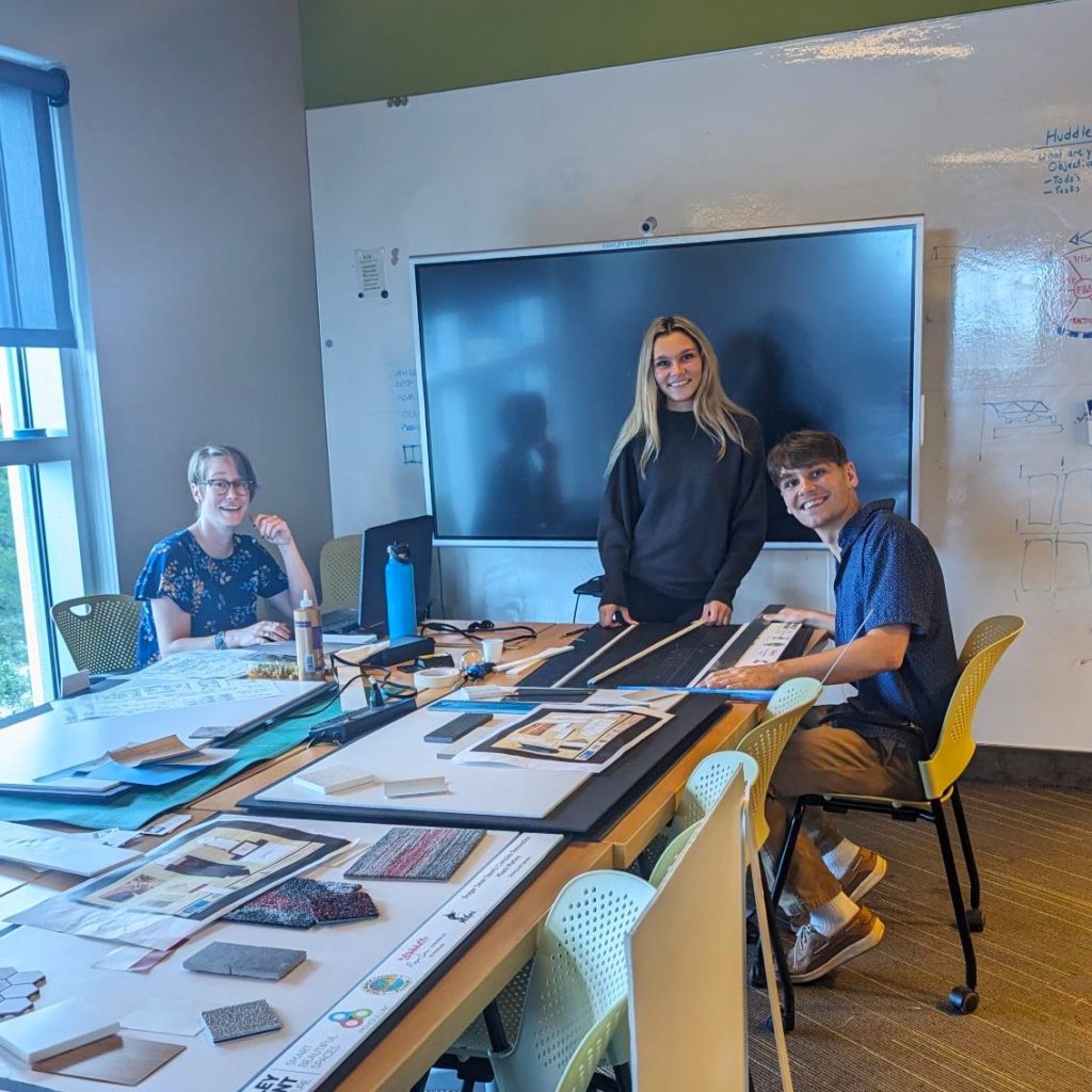 Lily works on creating some project boards along with intern Max and Interior Designer Sara.